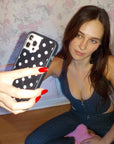 Lifestyle Image 02 Black and White Polka Dot iPhone Case